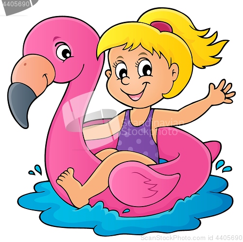 Image of Girl floating on inflatable flamingo 1