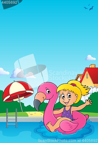 Image of Girl floating on inflatable flamingo 3