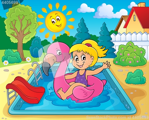 Image of Girl floating on inflatable flamingo 2
