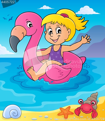 Image of Girl floating on inflatable flamingo 4