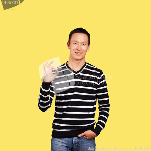 Image of Asian Man In Striped Pullover