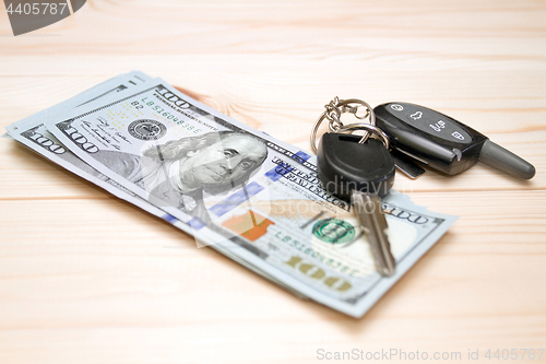 Image of Heap of money and car key