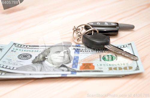 Image of Heap of money and car key