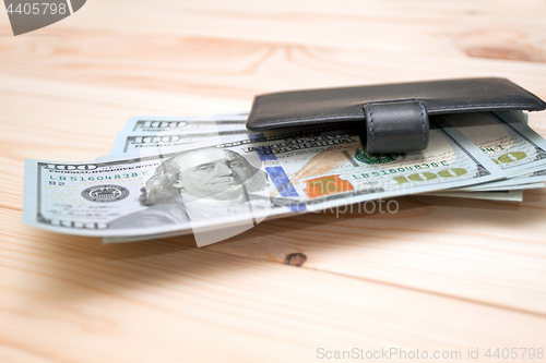 Image of Heap of money and wallet
