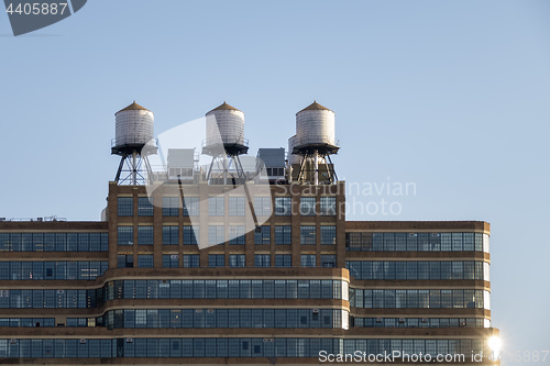 Image of some typical water tanks on the roof of a building in New York C