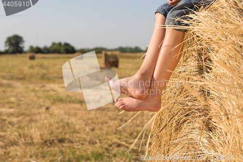 Image of Happy little boy playing in the park at the day time.