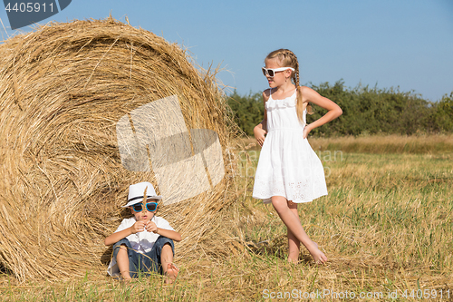 Image of Happy children playing in the park at the day time.