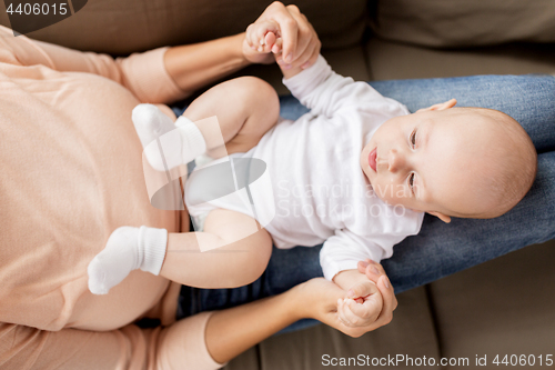 Image of mother with little baby boy at home