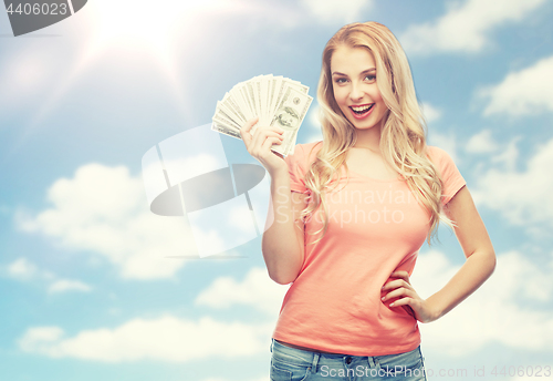 Image of happy young woman with usa dollar cash money