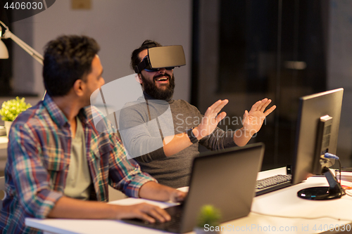 Image of creative man in virtual reality headset at office