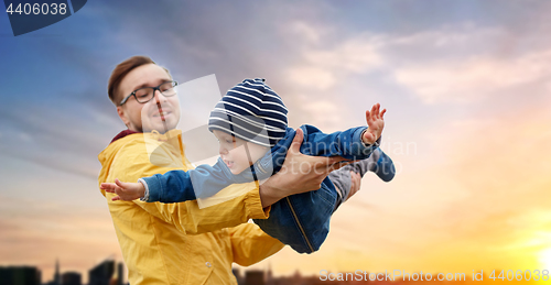 Image of father with son playing and having fun outdoors