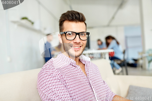 Image of happy creative male worker at office or student