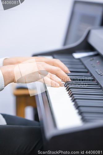 Image of Pianist is playing a song at the church