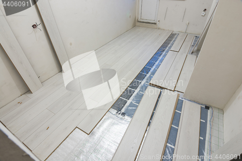 Image of Laying laminate with warm floor film