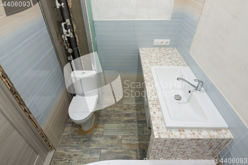 Image of Repair in the bathroom, top view of the toilet and washbasin