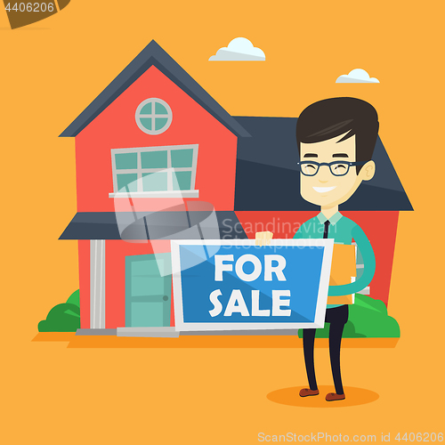 Image of Young asian realtor offering house.