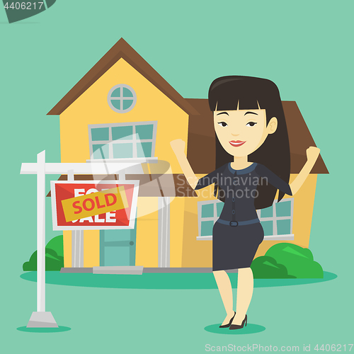 Image of Real estate agent with sold placard.