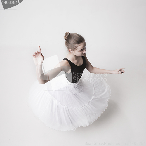 Image of The top view of the teen ballerina on white background