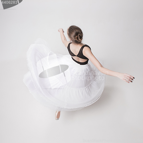 Image of The top view of the teen ballerina on white background