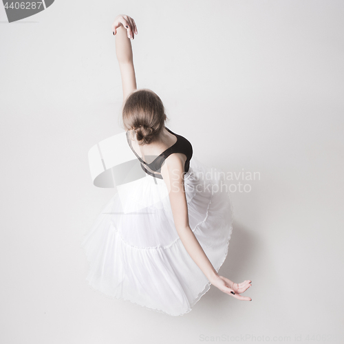 Image of The top view of the teen ballerina on white background