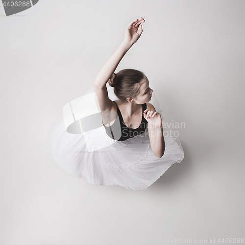 Image of The top view of the teen ballerina on white background