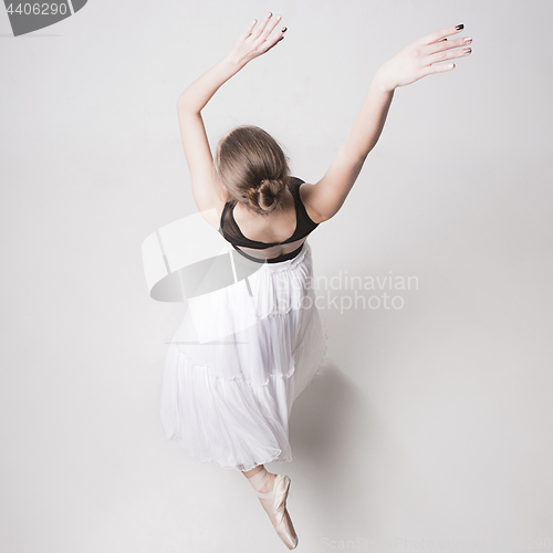 Image of The top view of the teen ballerina on white background