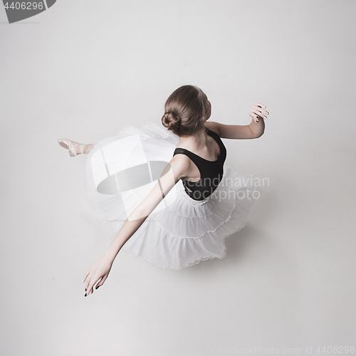 Image of The top view of the teen ballerina on white background