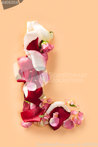 Image of Letter L made from red roses and petals isolated on a white background