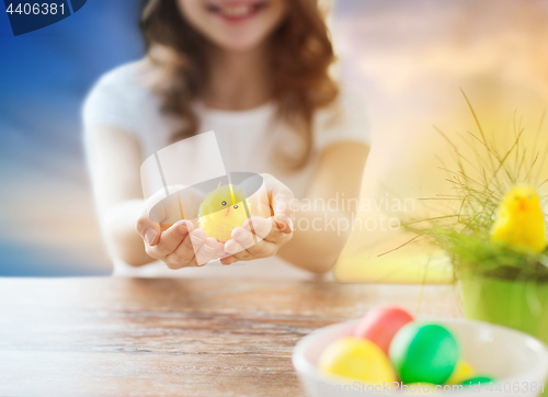 Image of close up of girl holding easter toy chicken