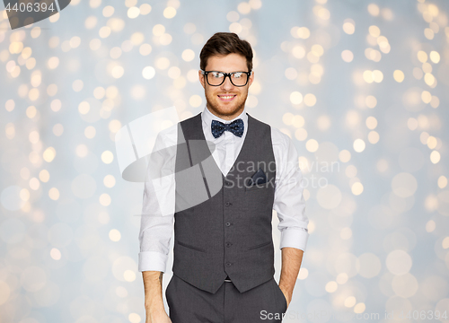 Image of happy man in festive suit and eyeglasses