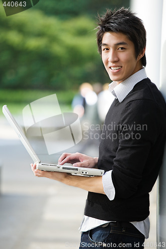 Image of Asian student with laptop