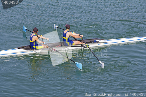 Image of Two young rowers in a racing rower boat