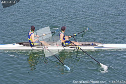 Image of Two young rowers in a racing rower boat