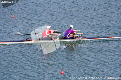 Image of Two young rowers in a racing rower boat