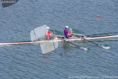 Image of Two young rowers in a racing rower boat