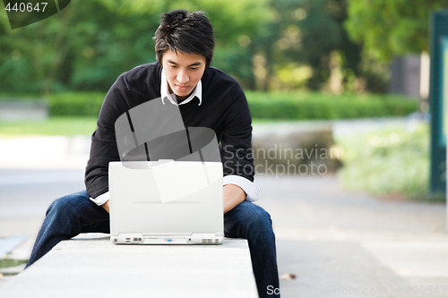 Image of Asian student with laptop