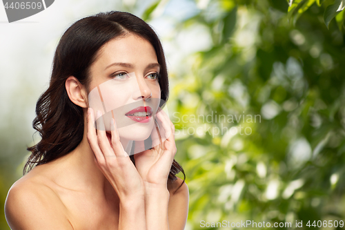 Image of beautiful smiling young woman with red lipstick