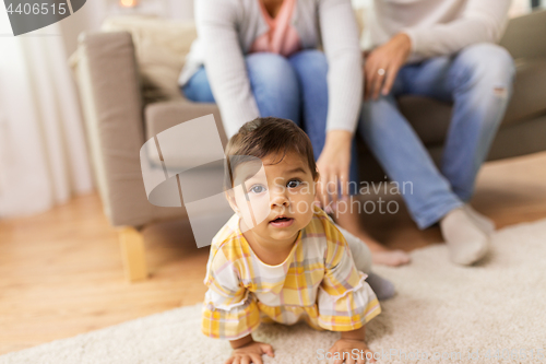 Image of little baby girl on floor at home