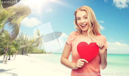 Image of happy woman or teen girl with red heart shape