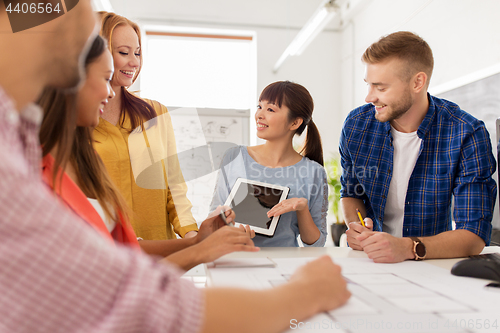 Image of creative team with tablet pc working at office