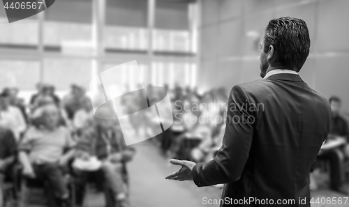 Image of Speaker Giving a Talk at Business Meeting.