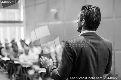 Image of Speaker Giving a Talk at Business Meeting.