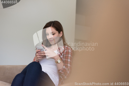 Image of woman using mobile phone