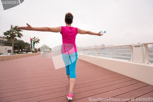 Image of young woman celebrating a successful training run