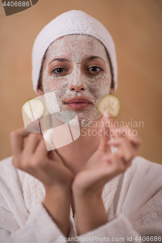 Image of Spa Woman applying Facial Mask