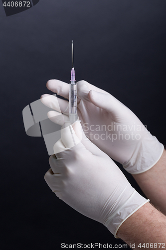 Image of Hands with syringe