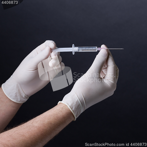 Image of Hands with syringe