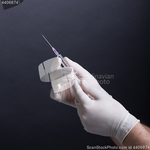 Image of Hands with syringe