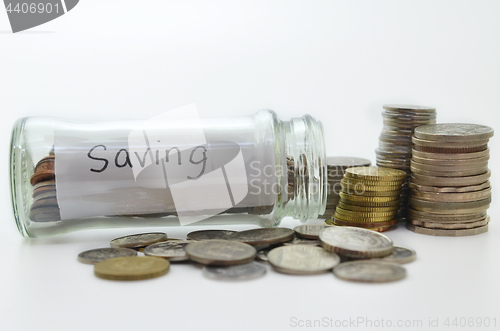 Image of Clear glass jar for tips with money