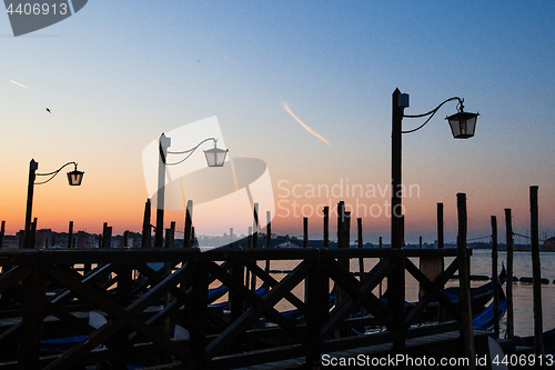 Image of Street lamp silhouette in Venice, Italy at sunrise